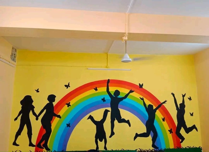 Wall Painting Design of Cheerful wall painting of a rainbow and children playing with butterflies